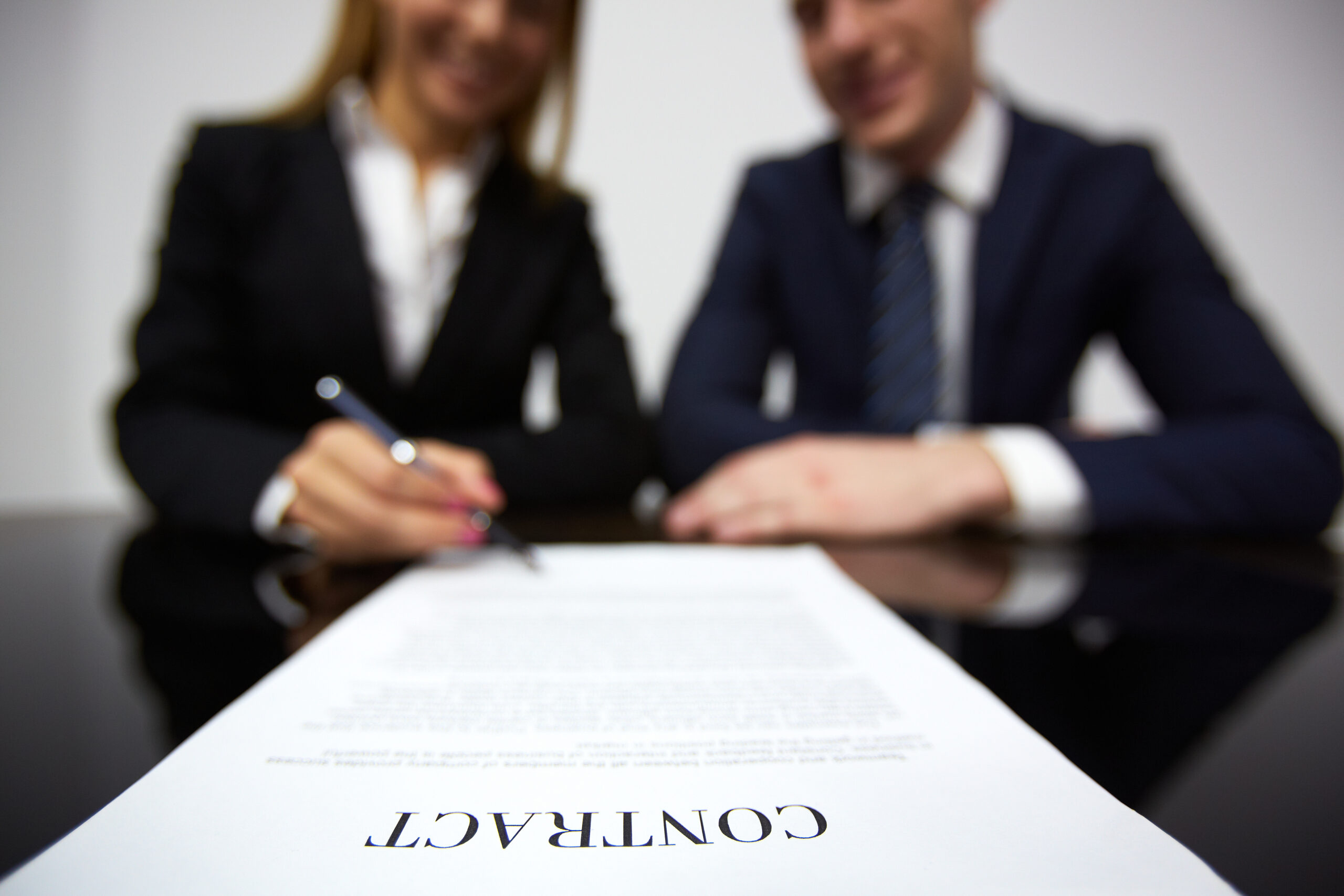 Image of human hands during signing contract